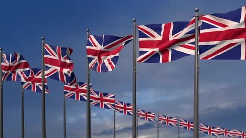 Waving United Kingdom Flags Against Blue Sky
