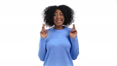Woman With Fingers Crossed Making a Wish