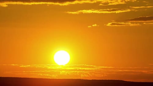 Fiery Sunrise Over the Horizon Time-Lapse
