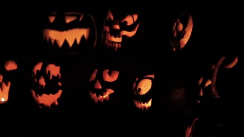 Glowing in the dark spooky Jack-o-lanterns carved from real pumpkins.