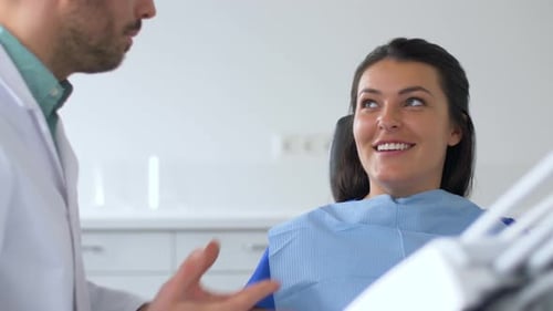 Dentist and Patient Talking at Dental Clinic 30