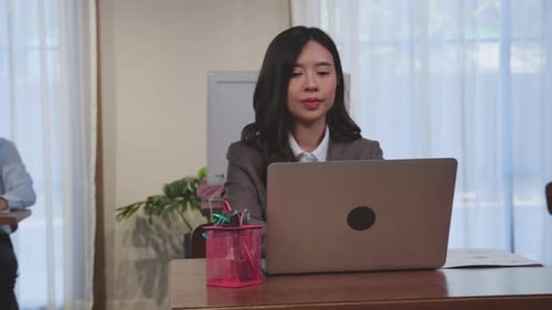 Young business woman is manager and employee working on laptop computer at office.