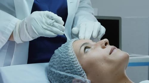 Woman Receiving Facial Injection in Hospital Setting
