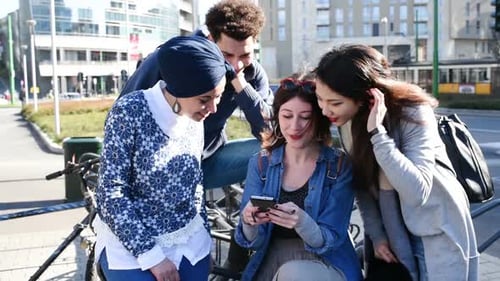 Mixed race group using smartphone chatting
