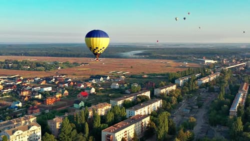 Aerial View of Hot Air Balloon Over Town