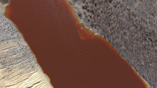 Aerial View of Red Contaminated Waterway