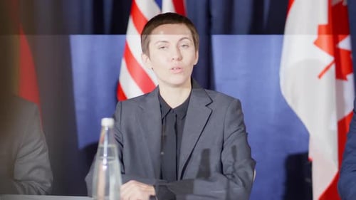Woman Speaking at a Formal Press Conference