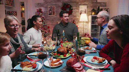 Family Christmas Gathering Celebrates With Dinner and Champagne