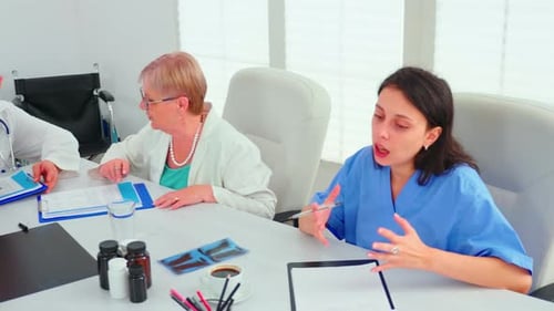 Medical Professionals Meeting to Discuss a Case
