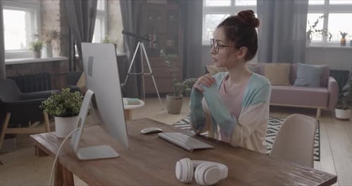 Young Woman in Video Conference at Home