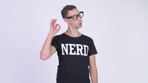 Studio Shot of Happy Nerd Man Giving Ok Sign