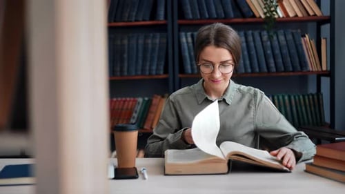 Academic Woman Reading Vintage Paper Book at Library Desk Learning Knowledge Searching Information