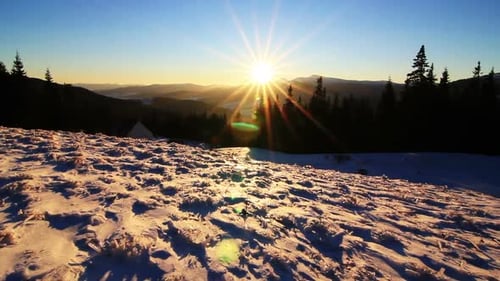 Golden Sun Touching Mountain on Sunset. Winter in Mountains. Ukraine Carpathians Dragobrat