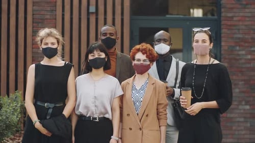 Portrait of Multiethnic Business People in Masks on Street