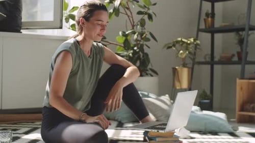 Young Cheerful Woman Chatting on Web Call on Laptop at Home