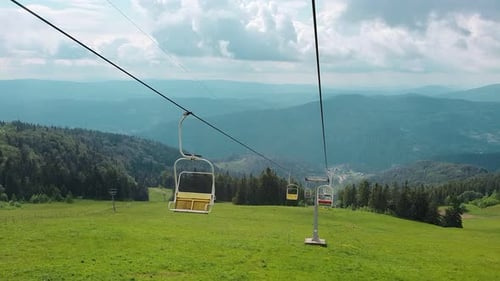 View From the Chair of the Cable Car on the Panorama of the Mountains on a Summer Sunny Day