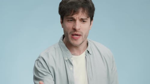 Furious Man Yelling and Gesturing Angrily