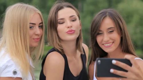 Three Young Women Taking a Selfie Together