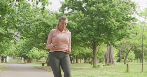 Senior woman running in the park