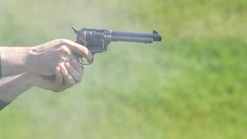Revolver Firing with Puff of Smoke in Daylight