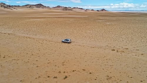 Car Rides Through the Sandy Desert