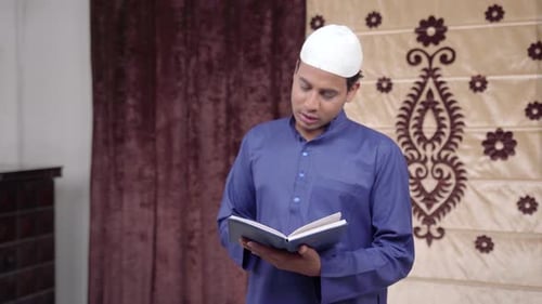 Man Reading Religious Book Indoors