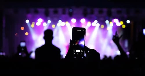 Crowd Enjoys Exciting Concert with Stage Lights