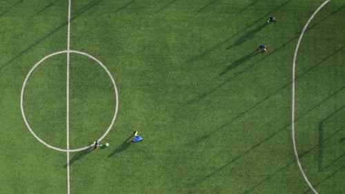 Drone View of Skillful Soccer Forward Scoring Goal