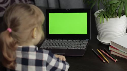 Children Distance Education on Laptop During Online Lesson at Home. Green Screen