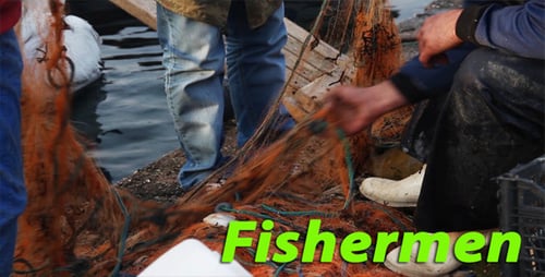 Adults Sorting Fishing Nets by the Water