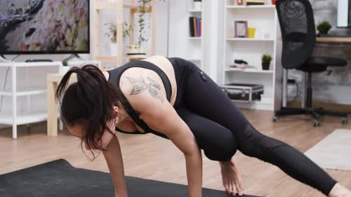 Woman Doing a Yoga Pose on Yoga Mat
