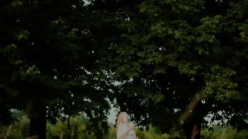 Blonde Woman throwing Wedding Bouquet into the Air
