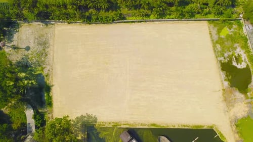 Aerial view of dry ground rough cracks in the land with sand in factory industry for construction