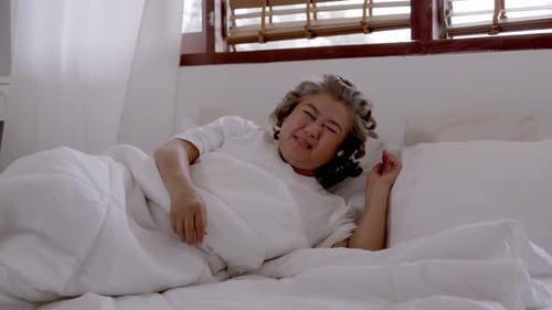 Senior Woman Waking Up with Chest Pain