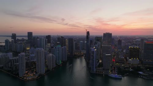 Slide and Pan Aerial View of City at Dusk