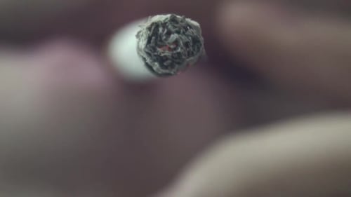 Closeup of a cigarette being smoked.
