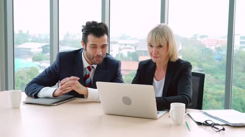 Two Happy Business People Celebrate at Office