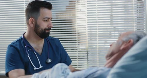 Doctor Using Stethoscope in Hospital