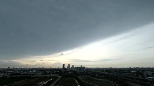 Cityscape View Under Dramatic Sky at Dusk