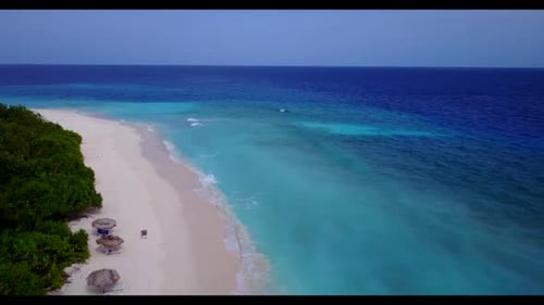 Aerial drone view scenery of paradise coastline beach lifestyle by clear lagoon and white sand backg