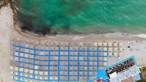 Tropical Beach with Umbrellas from Birds Eye View