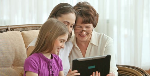 Multi-Generational Family Enjoying a Tablet Together