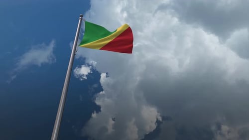 Republic of the Congo Flag Waving in Wind with Dynamic Clouds