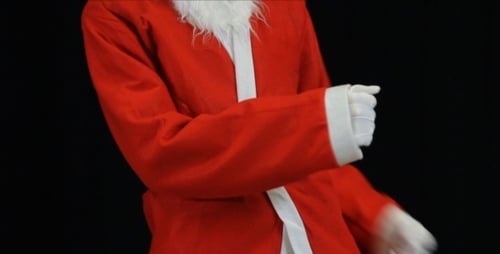 Dancing Santa Body Moves Against Black Backdrop