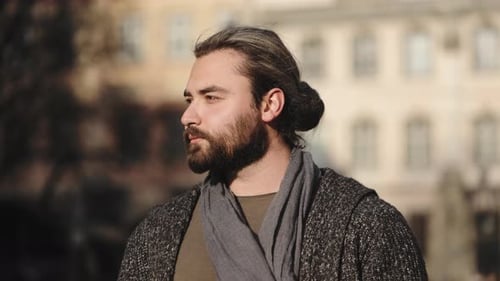 Bearded Man Looking at Camera Outdoors