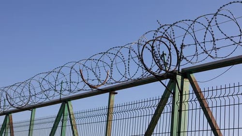 Barbed Wire Fence Underneath Blue Sky