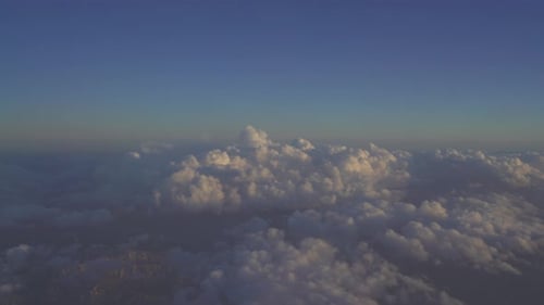 Aerial View of Cumulus Clouds at Sunrise or Sunset