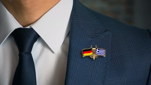 Man's Elegant Suit with Germany and Greece Flag Pins