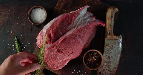 Raw Meat with Salt, Pepper, and Rosemary