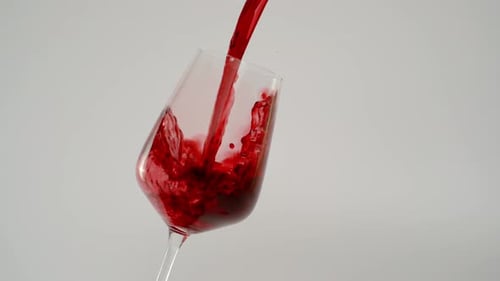 Pouring Red Wine Into a Glass